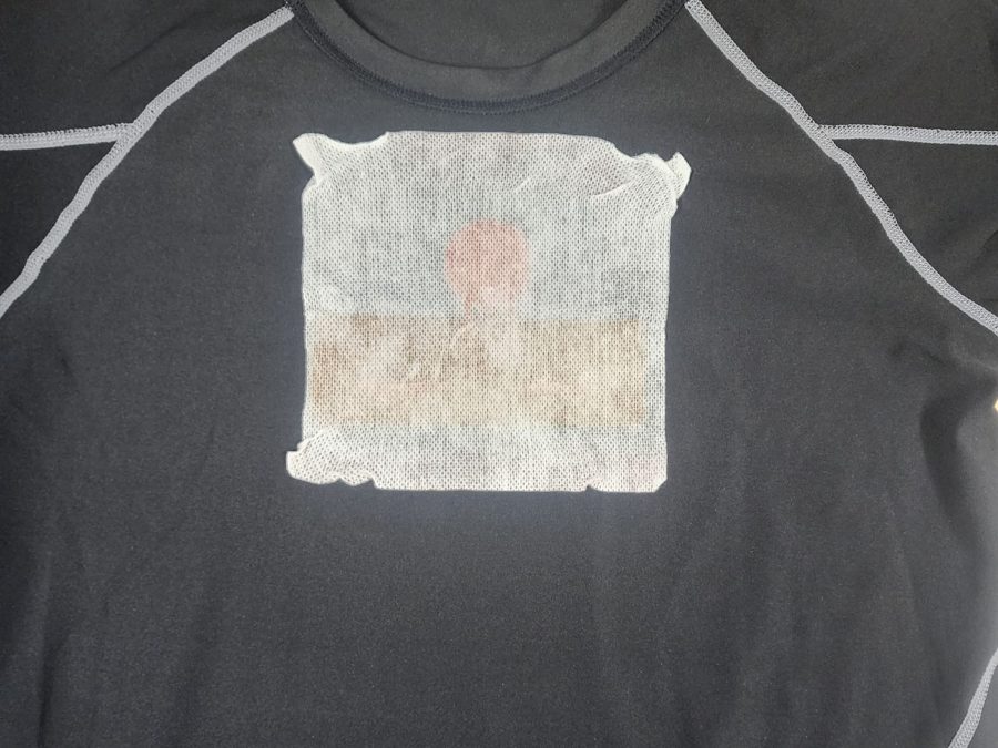 The finished tag adhered to a shirt, worn to monitor breathing