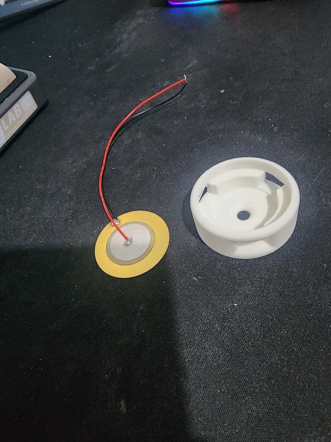 27mm piezoelectric disc beside its 3D-printed housing